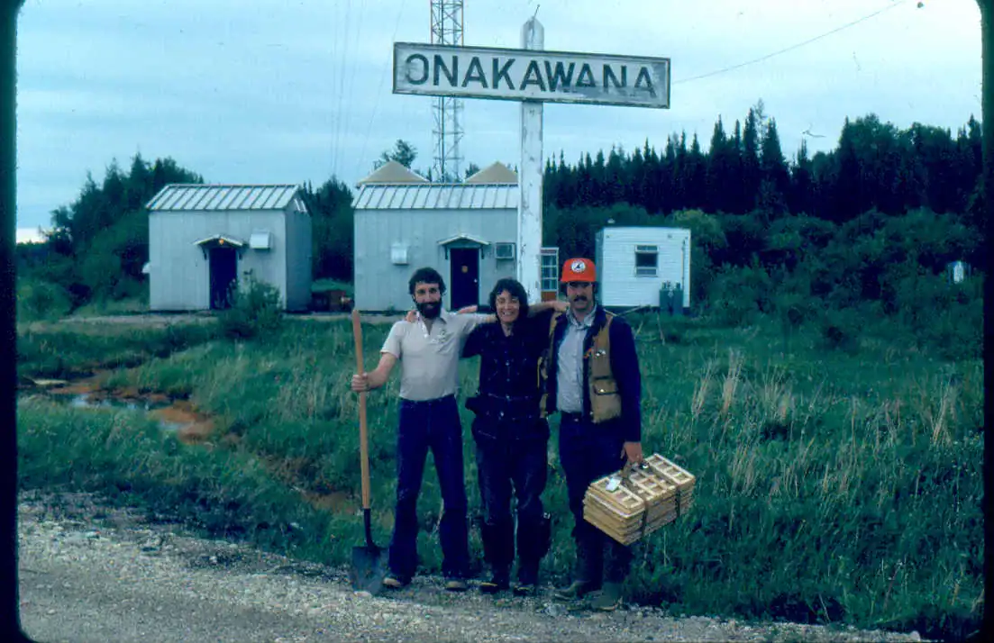 Three field researchers at Onakawana carrying sampling equipment